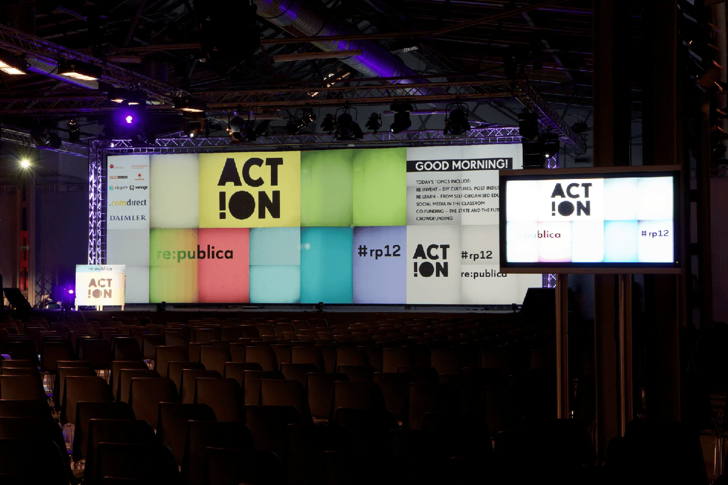 The backdrop of the main stage, a digital representation of the paper mosaic aesthetic.